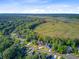 Scenic aerial shot showcases homes amidst a vast marshland, blending nature and neighborhood at 5433 Clearview Dr, North Charleston, SC 29420