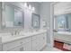 Upscale bathroom featuring dual sinks with white marble countertops and decorative mirrors at 5433 Clearview Dr, North Charleston, SC 29420