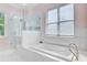 Bright bathroom featuring a separate shower and soaking tub at 5433 Clearview Dr, North Charleston, SC 29420