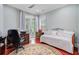 Bright bedroom with a daybed, desk area, and access to a charming outdoor space at 5433 Clearview Dr, North Charleston, SC 29420