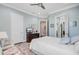 Comfortable bedroom featuring a large bed, stylish decor, and an open doorway for natural light at 5433 Clearview Dr, North Charleston, SC 29420