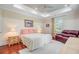 Comfortable bedroom with natural light, a decorative ceiling, and cozy seating near the window at 5433 Clearview Dr, North Charleston, SC 29420