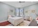 Bright bedroom with a comfortable bed, matching chairs, and serene decor for relaxation at 5433 Clearview Dr, North Charleston, SC 29420