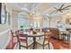 Charming dining room with a round wooden table and upholstered chairs, adjacent to the living area at 5433 Clearview Dr, North Charleston, SC 29420