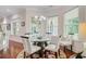 Bright dining room featuring a glass table, six chairs, and natural light from multiple windows at 5433 Clearview Dr, North Charleston, SC 29420