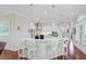 Modern kitchen with white cabinets, marble countertops, and a stylish island with seating at 5433 Clearview Dr, North Charleston, SC 29420