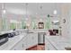 Open-concept kitchen with marble countertops, stainless appliances, and view to living area at 5433 Clearview Dr, North Charleston, SC 29420