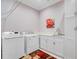 Functional laundry room with washer, dryer, storage cabinets and sink at 5433 Clearview Dr, North Charleston, SC 29420