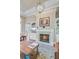 Elegant living room featuring a marble fireplace with a burning fire and a decorative chandelier at 5433 Clearview Dr, North Charleston, SC 29420