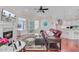 Open living space with a fireplace, display cabinet, and seamless transition to the modern kitchen at 5433 Clearview Dr, North Charleston, SC 29420