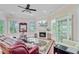Elegant living room with fireplace, large windows, stylish furnishings, and hardwood floors at 5433 Clearview Dr, North Charleston, SC 29420