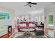Spacious living room with hardwood floors, comfortable seating, and an open layout connecting to the kitchen at 5433 Clearview Dr, North Charleston, SC 29420
