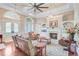 Bright living room with a fireplace and an oversized ceiling fan at 5433 Clearview Dr, North Charleston, SC 29420
