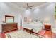 Spacious bedroom with hardwood floors, a ceiling fan, and elegant decor at 5433 Clearview Dr, North Charleston, SC 29420