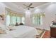 Bright main bedroom with hardwood floors, a ceiling fan, and large windows at 5433 Clearview Dr, North Charleston, SC 29420