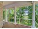 Spacious covered porch with white columns and railing overlooking lush backyard landscaping at 5433 Clearview Dr, North Charleston, SC 29420