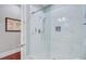 Elegant glass-enclosed shower with white marble tile and modern fixtures in a renovated home at 5433 Clearview Dr, North Charleston, SC 29420