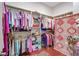 Walk-in closet with custom shelving and hardwood floors at 5433 Clearview Dr, North Charleston, SC 29420