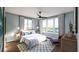 Bright bedroom features a ceiling fan, large windows, and neutral-colored decor at 560 Hayes Park Blvd # Hr 12, Johns Island, SC 29455