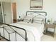 Bright bedroom features metal frame bed, neutral bedding, and stylish nightstands with lamps at 560 Hayes Park Blvd # Hr 12, Johns Island, SC 29455