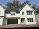 Attractive two-story home with white siding, black roof, and attached two-car garage at 560 Hayes Park Blvd # Hr 12, Johns Island, SC 29455