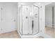 Modern bathroom with a glass-enclosed shower and white tiled walls at 5802 Palmetto Dr # B-521/519, Isle of Palms, SC 29451