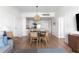 Open dining area with a modern table and seating, flowing into the kitchen at 5802 Palmetto Dr # B-521/519, Isle of Palms, SC 29451