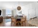 Dining area with a round table and chairs, complemented by natural light and stylish decor at 5802 Palmetto Dr # B-521/519, Isle of Palms, SC 29451