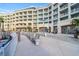 Beautiful multi-story condo building featuring multiple balconies, common area, and comfortable outdoor seating at 5802 Palmetto Dr # B-521/519, Isle of Palms, SC 29451