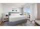 Serene main bedroom with a plush bed, balcony access, and elegant decor at 5802 Palmetto Dr # B-521/519, Isle of Palms, SC 29451
