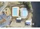 Aerial view of community amenities, showcasing pools, playground, and lake access at 661 Black Pine Rd, Moncks Corner, SC 29461