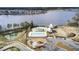 Aerial view of the community pool, playground, and lakefront amenities at new home community at 661 Black Pine Rd, Moncks Corner, SC 29461