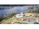 Aerial view of lakefront community pool, play area, and lakefront recreation area at 661 Black Pine Rd, Moncks Corner, SC 29461
