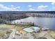 High aerial view showcasing community amenities: pool, playground, pond and a sprawling lake at 661 Black Pine Rd, Moncks Corner, SC 29461