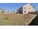 Spacious backyard featuring a sports net, lush lawn, and a fenced in yard at 661 Black Pine Rd, Moncks Corner, SC 29461