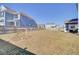 Large, open backyard with a sports net, well-maintained lawn, and a fenced perimeter at 661 Black Pine Rd, Moncks Corner, SC 29461