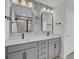 Modern bathroom boasting double sink vanity, sleek fixtures, and patterned accent wall at 661 Black Pine Rd, Moncks Corner, SC 29461