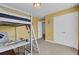 Bedroom with loft bed, desk area, and neutral carpeting at 661 Black Pine Rd, Moncks Corner, SC 29461