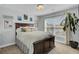 Comfortable bedroom with a large bed, light blue walls, and bright natural light at 661 Black Pine Rd, Moncks Corner, SC 29461