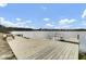 Wooden dock with benches overlooking the lake at 661 Black Pine Rd, Moncks Corner, SC 29461