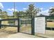 Gated community dog park with rules posted, providing a safe and enclosed space for residents to exercise their pets at 661 Black Pine Rd, Moncks Corner, SC 29461