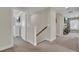 Bright hallway with neutral walls, carpet flooring, and access to bedrooms at 661 Black Pine Rd, Moncks Corner, SC 29461