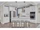 Modern kitchen with stainless steel appliances, white cabinets and center island with barstool seating at 661 Black Pine Rd, Moncks Corner, SC 29461