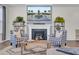 Relaxing living room with a fireplace, comfortable seating, a soft rug, and a TV above the fireplace at 661 Black Pine Rd, Moncks Corner, SC 29461