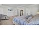 Inviting main bedroom featuring a bed with blue stripes, dresser, and lots of natural light at 661 Black Pine Rd, Moncks Corner, SC 29461