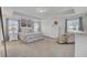 Serene primary bedroom with tray ceilings, soft blue accents, and ample natural light at 661 Black Pine Rd, Moncks Corner, SC 29461
