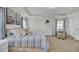 Spacious main bedroom featuring tray ceilings, neutral tones, and a relaxing sitting area at 661 Black Pine Rd, Moncks Corner, SC 29461