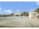 A pristine community pool with lounge chairs and a pool house at 661 Black Pine Rd, Moncks Corner, SC 29461