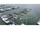 This is a detailed close-up view of boat slips with multiple boats berthed next to them in clear water at 67 W 10Th St # D-26, Folly Beach, SC 29439