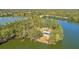 A captivating aerial view of a lakeside property with lush greenery and stunning waterfront views at 774 Clay Field Trl, Summerville, SC 29485